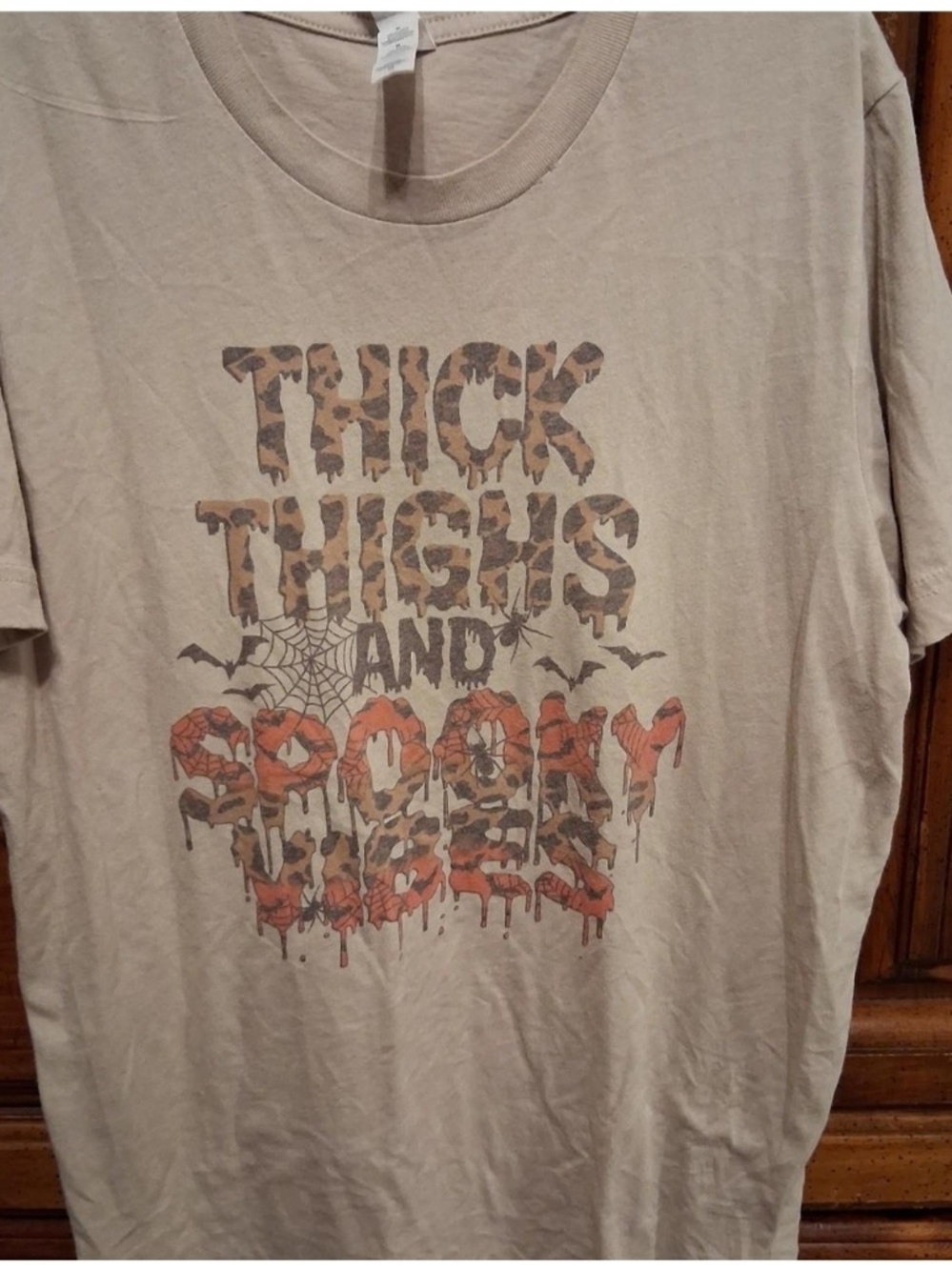 Bella Canvas Tan Graphic Tee with Leopard Print and Orange Accents